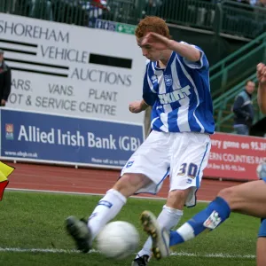 Tommy Fraser crosses the ball