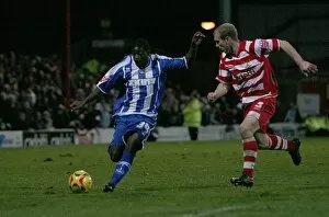Images Dated 27th November 2006: Alastair John, on his Albion debut, takes on Gareth Roberts