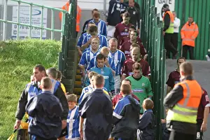 the Albion & Northampton teams leave the Withdean dressing rooms
