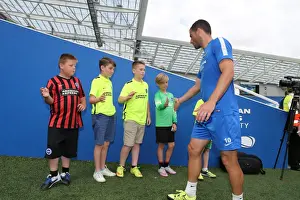 Prints of Young Seagulls Open Training Session 31st July 2015. Albion players leave the pitch Pre-Season Prints: Albion Players Exit Young Seagulls Open Training Session (31st July 2015)