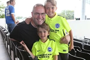 Images Dated 15th August 2015: Brighton & Hove Albion: Euphoric Fans Celebrate Championship Victory at Craven Cottage (15.08.2015)