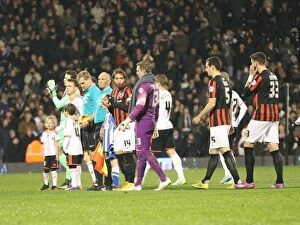 Images Dated 29th December 2014: Brighton and Hove Albion Fans in Full Swing: A Passionate Atmosphere at Fulham's Craven Cottage