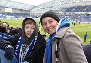 Images Dated 14th March 2015: Brighton and Hove Albion Fans in Full Swing: A Sea of Colors against Wolverhampton Wanderers