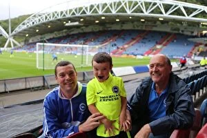 Images Dated 18th August 2015: Brighton and Hove Albion Fans in Full Swing: Huddersfield Championship Showdown, August 2015