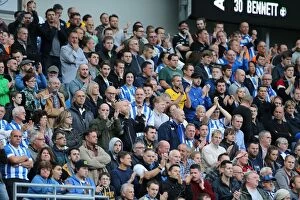 Images Dated 25th October 2014: Brighton & Hove Albion Fans in Full Swing at American Express Community Stadium during SkyBet