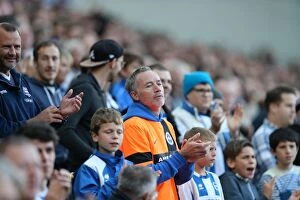 Images Dated 25th October 2014: Brighton & Hove Albion Fans in Full Swing at American Express Community Stadium during SkyBet