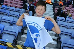 Wigan Athletic 18APR15 Prints: Brighton and Hove Albion Fans Unwavering Support at Wigan Athletic Championship Match
