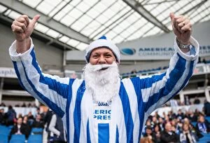 Images Dated 19th December 2015: Brighton and Hove Albion FC: A Merry Championship Clash - Fan in Santa Gear Amidst the Action (vs)