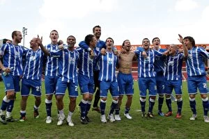 Celebration Collection: Brighton and Hove Albion: League 1 Title Winning Moment at Walsall, April 2011