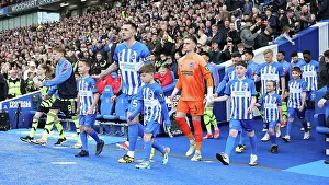 Leads Out Brighton And Hove Albion Team Prints: Brighton and Hove Albion v Arsenal Premier League 06APR24
