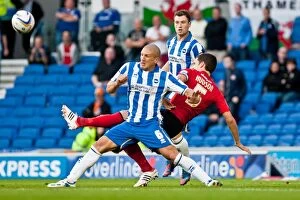 Images Dated 21st August 2012: Brighton & Hove Albion vs. Cardiff City: El-Abd vs. Hudson - A Fierce Rivalry in the Championship