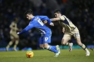 Images Dated 24th February 2015: Brighton & Hove Albion vs Leeds United: Joao Carlos Teixeira's Intense Midfield Battle