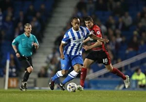 Images Dated 14th April 2015: Brighton & Hove Albion's Chris O'Grady Faces Off Against Huddersfield Town in Sky Bet Championship
