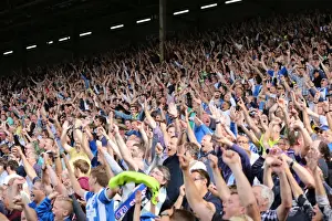 Celebratory Prints: Brighton and Hove Albion's Euphoric Fans Celebrate at Craven Cottage during Sky Bet Championship Match vs Fulham