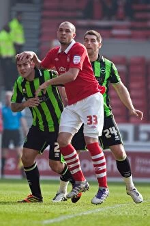 Images Dated 24th March 2012: Brighton & Hove Albion's Joe Mattock and Joel Lynch in Action Against Nottingham Forest