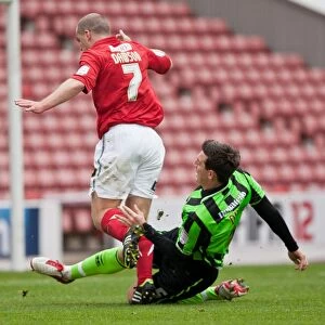 Images Dated 28th April 2012: Brighton & Hove Albion's Lewis Dunk Makes a Tackle Against Barnsley, Championship 2012