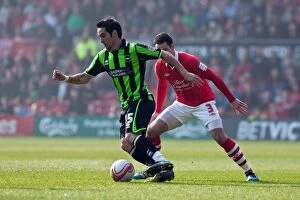 Images Dated 24th March 2012: Brighton & Hove Albion's Vicente Faces Off Against Nottingham Forest in NPower Championship Clash