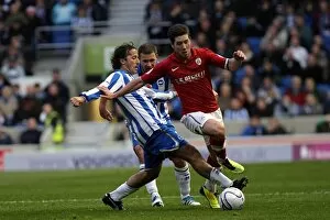 Images Dated 6th November 2011: Brighton v Barnsley nPower Championship - Mauricio Taricco challenges