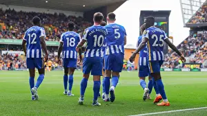 Takes A Penalty And Prints: Brighton's Dunk Faces Off Against Wolves in Premier League Clash (30APR22)