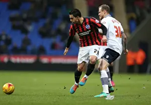 Bolton Wanderers 28FEB15 Prints: Brighton's Kayal Faces Off Against Bolton: Intense Midfield Battle (28FEB15)