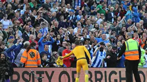 Prints of Brighton and Hove Albion goalkeeper Mathew Ryan (1) gives his shorts to a fan on the lap of appreciation 2018-19 Matches Prints: Brighton's Mat Ryan Gifts Shorts to Appreciative Fan in Emotional Moment at Falmer Stadium
