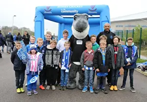 Watford 25APR15 Prints: Cricket Interlude: Tymal Mills and Sharky Amuse Fans during Brighton & Hove Albion vs