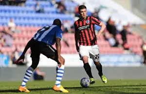 Danny Holla in Action: Brighton Midfielder Fights for Possession against Wigan Athletic (18APR15)