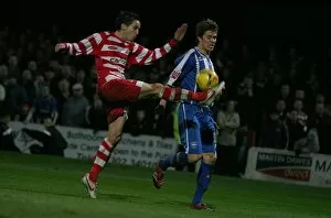 Images Dated 27th November 2006: Dean Hammond is challenged by Brian Stock