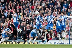 Images Dated 31st March 2012: Defending the Wall: LuaLua, Vokes, and Sam Shield Middlesbrough's Free Kick at Amex Stadium