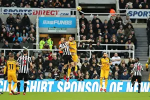 Newcastle United 30DEC17 Prints: Dunk vs. Joselu: Intense Battle Between Newcastle and Brighton Defender and Forward in Premier League Clash (30DEC17)
