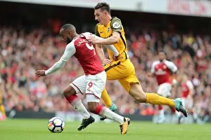 Images Dated 1st October 2017: Dunk vs. Lacazette: Intense Battle at the Emirates - Arsenal vs. Brighton and Hove Albion, 01OCT17