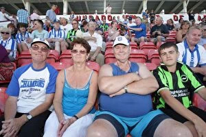 Portugal Pre-season 2011-12 Collection: Electric Atmosphere: Brighton and Hove Albion Away Crowds in Portugal Pre-season 2011-12