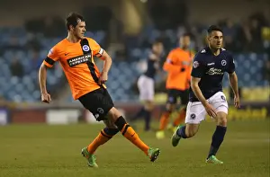 Millwall Prints: Gordon Greer Leads Brighton and Hove Albion in Intense Championship Clash against Millwall (17MAR15)