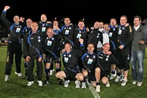 Gus and his backroom staff celebrate promotion to The Championship in 2011