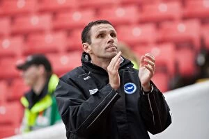 Images Dated 28th April 2012: Gus Poyet Appreciates Brighton & Hove Albion Fans Amidst Barnsley's Oakwell Stadium (April 28, 2012)
