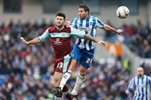 Images Dated 23rd February 2013: Intense Aerial Clash: Matthew Upson vs. Charlie Austin at Brighton & Hove Albion vs