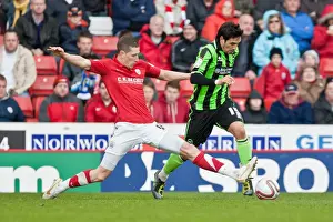 Barnsley 28-04-2012 Prints: Intense Moment: Jim McNulty Chases Vicente in Npower Championship Clash between Barnsley and Brighton & Hove Albion