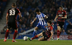 Joao Carlos Teixeira in Action: Brighton Midfielder Battles Huddersfield Town at American Express Community Stadium (14APR15)