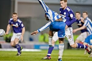 Images Dated 20th March 2012: Kazenga LuaLua's Shooting Moment: Brighton & Hove Albion vs Derby County in Npower Championship