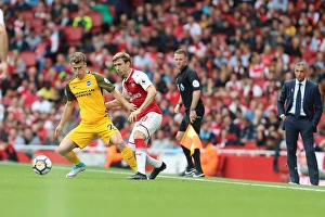 March vs Monreal: Intense Battle in Arsenal vs. Brighton and Hove Albion Premier League Clash (1st October 2017)