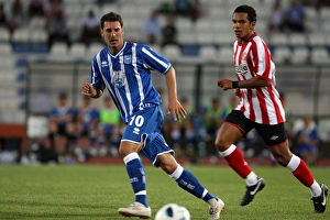 Images Dated 21st July 2010: Matt Sparrow passes the ball - shadowed by Kieron Richardson