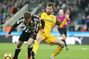 Images Dated 30th December 2017: Propper Tackles Gayle: Intense Midfield Battle in Newcastle vs. Brighton (30DEC17)