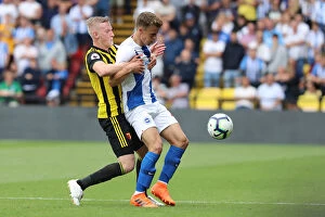 Images Dated 11th August 2018: Solly March Shields Ball from Will Hughes: Watford vs. Brighton and Hove Albion