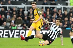 Images Dated 30th December 2017: Stephens vs Joselu: Intense Midfield Battle in Newcastle United vs Brighton and Hove Albion