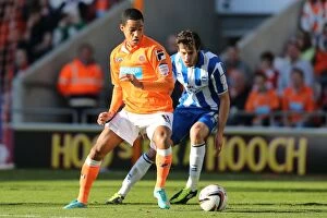 Images Dated 27th October 2012: Thomas Ince vs. Will Buckley: Intense Moment from Blackpool vs. Brighton & Hove Albion, 2012