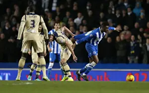 Leeds United 24FEB15 Prints: Tug-of-War in Midfield: Rohan Ince Caught in the Middle during Brighton & Hove Albion vs Leeds United (24FEB15)